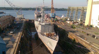 dry docked ship being prepared for ship repairs