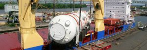 custom metal fabricated component being transported aboard a ship