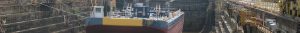 dry docked ship being prepared for repairs