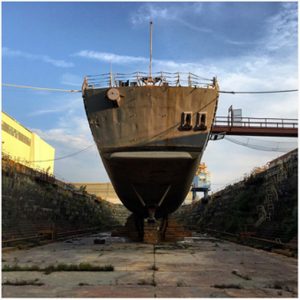 dry docked ship in ship yard