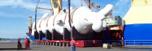 large fabrication component being transported on ship yard