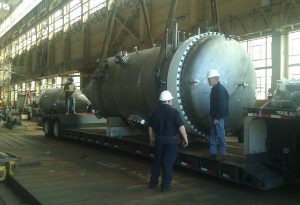 foreman discussing custom metal fabricated ship component