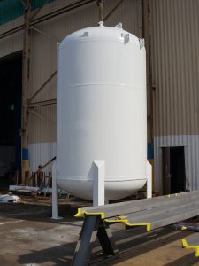 Large metal boiler with paint blasted off